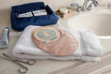convatec closed ostomy bag with scissors and accessories