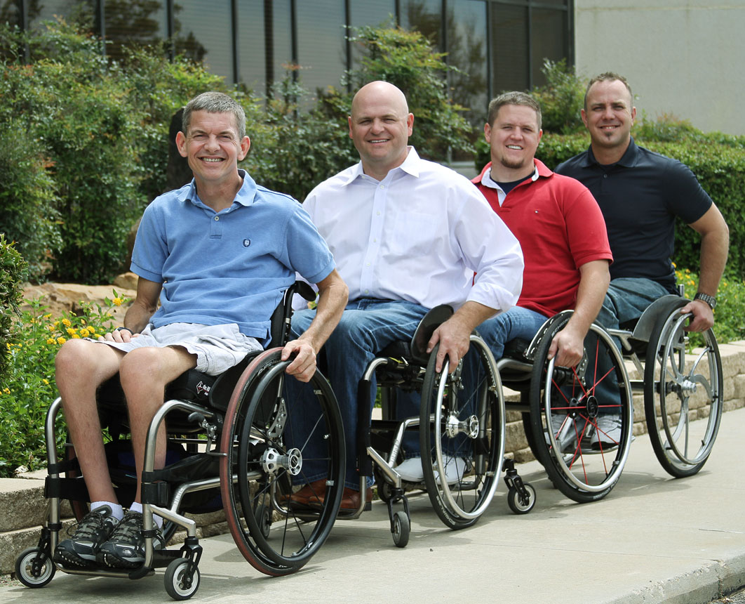 4 men in wheelchairs