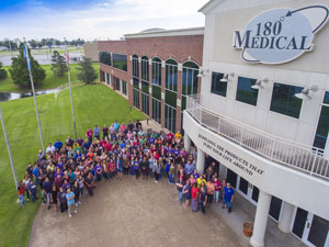 180 Medical employees in front of building