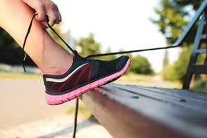 Person tying running shoes