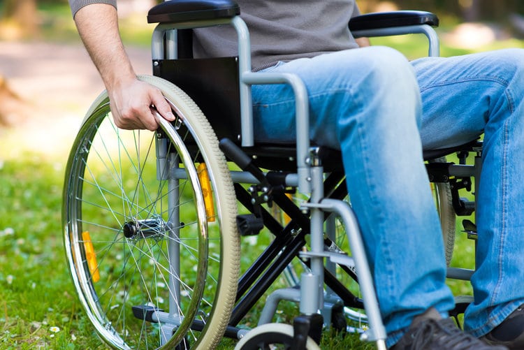 man in wheelchair sci month