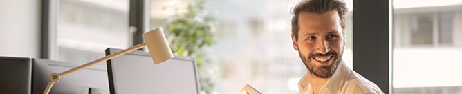 Man smiling in an office