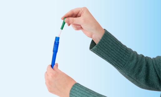 Hand removing Cure Twist catheter from compact package