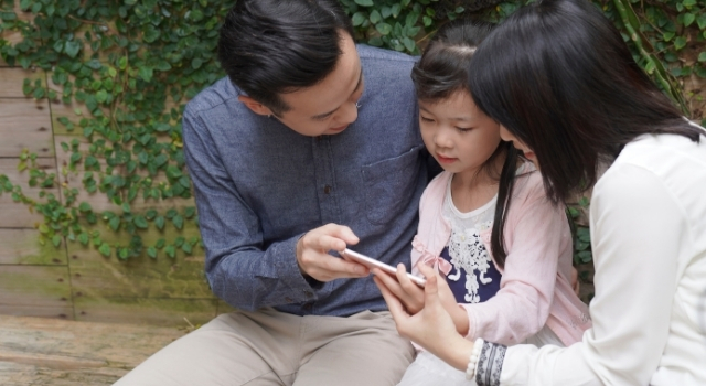 image of parents talking to child