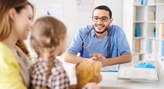 picture of child and parent with doctor