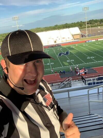 Tyler refereeing a North Edmond football game